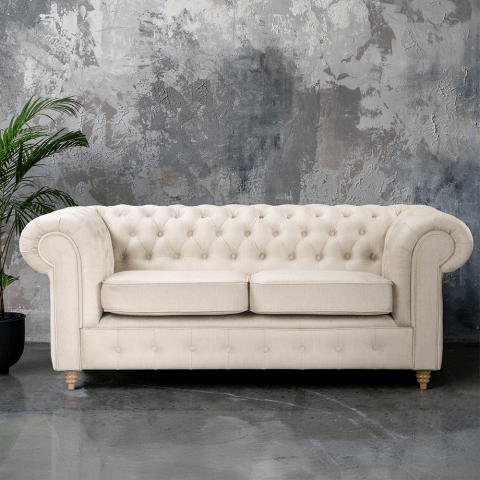 Beżowa sofa dwuosobowa pikowana Chesterfield z funkcją spania Fins
